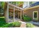 Wonderful backyard with a covered patio and manicured landscaping surrounding the brick home at 712 Wakendaw Blvd, Mount Pleasant, SC 29464