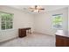 Bedroom with two windows, ceiling fan and carpeting at 712 Wakendaw Blvd, Mount Pleasant, SC 29464