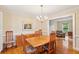 Bright dining room with hardwood floors, chandelier lighting, and ample space for entertaining at 712 Wakendaw Blvd, Mount Pleasant, SC 29464