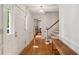 Inviting foyer with hardwood floors, traditional molding, and a staircase leading to the upper level at 712 Wakendaw Blvd, Mount Pleasant, SC 29464