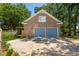 Detached two-car garage with blue doors and brick facade at 712 Wakendaw Blvd, Mount Pleasant, SC 29464