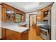 Well-lit kitchen with stainless appliances, hardwood floors, and open access at 712 Wakendaw Blvd, Mount Pleasant, SC 29464