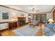 Spacious living room with fireplace, hardwood floors, ceiling fan, and natural light at 712 Wakendaw Blvd, Mount Pleasant, SC 29464