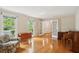 Comfortable living room with large windows, hardwood floors, and a cozy seating area at 712 Wakendaw Blvd, Mount Pleasant, SC 29464