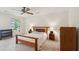 Cozy primary bedroom featuring a ceiling fan, large window, and neutral carpet at 712 Wakendaw Blvd, Mount Pleasant, SC 29464