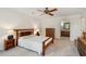 Bright bedroom featuring a ceiling fan, carpet, and en suite bathroom at 712 Wakendaw Blvd, Mount Pleasant, SC 29464