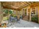 Shaded outdoor patio space features a wooden pergola and a metal table with chairs at 712 Wakendaw Blvd, Mount Pleasant, SC 29464