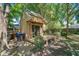 Backyard playhouse with deck, ladder, and sliding glass door offers extra space to enjoy the outdoors at 712 Wakendaw Blvd, Mount Pleasant, SC 29464
