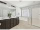 Bathroom features dual vanity, a separate tub and a glass door shower at 7511 Hawks Cir, Hanahan, SC 29410