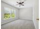 This is a spacious bedroom that is bright with a ceiling fan at 7511 Hawks Cir, Hanahan, SC 29410