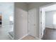 Bright entryway featuring neutral colored walls, tile flooring, and entry to rooms at 7511 Hawks Cir, Hanahan, SC 29410