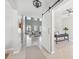 Bright foyer leads to a spacious living room with soaring ceilings and an adjacent home office at 7511 Hawks Cir, Hanahan, SC 29410