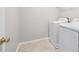 Functional laundry room featuring tile flooring and appliances ready for use at 7511 Hawks Cir, Hanahan, SC 29410