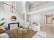 Bright living room featuring neutral decor, a staircase, and a view into another area at 7511 Hawks Cir, Hanahan, SC 29410