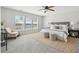 Serene main bedroom featuring a plush bed, neutral colors, and a ceiling fan at 7511 Hawks Cir, Hanahan, SC 29410