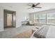 Spacious main bedroom featuring a soft rug, sitting area, and abundant natural light at 7511 Hawks Cir, Hanahan, SC 29410