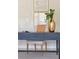 Close up view of an office featuring a dark desk, plants and wall art at 7511 Hawks Cir, Hanahan, SC 29410