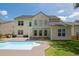 Back of home featuring an in-ground pool and covered patio area great for outdoor entertaining at 7511 Hawks Cir, Hanahan, SC 29410