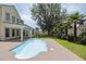 In-ground pool and patio with a home featuring a covered patio in the background at 7511 Hawks Cir, Hanahan, SC 29410
