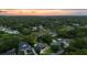 An aerial view showcasing the home's proximity to waterways, lush greenery, and neighborhood at 774 Creekside Dr, James Island, SC 29412