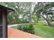 Scenic backyard showcasing a wooden deck with lush landscaping and mature trees, providing a tranquil outdoor space at 774 Creekside Dr, James Island, SC 29412