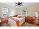 Cozy bedroom with neutral tones, two windows, and stylish decor, creating a peaceful retreat at 774 Creekside Dr, James Island, SC 29412