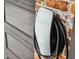 Close-up of a Tesla charging station mounted on a brick wall with a modern design at 774 Creekside Dr, James Island, SC 29412