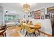 Inviting dining area featuring hardwood floors, a stylish light fixture, and an eclectic gallery wall display at 774 Creekside Dr, James Island, SC 29412