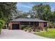 Charming brick home with a well-manicured front yard and black trim accents at 774 Creekside Dr, James Island, SC 29412