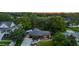 A front exterior view of a brick home showcasing mature trees and landscaping at 774 Creekside Dr, James Island, SC 29412