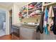 Well-equipped laundry room with stainless steel washer and dryer, plus ample storage space at 774 Creekside Dr, James Island, SC 29412