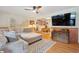 Living room with a large sectional sofa, hardwood floors, vintage trunk, and an adjacent dining area at 774 Creekside Dr, James Island, SC 29412