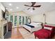 Serene main bedroom with vaulted ceilings, French doors, fireplace, and a cozy seating area at 774 Creekside Dr, James Island, SC 29412