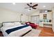 Inviting main bedroom features vaulted ceilings, a cozy chaise lounge, and built in vanity at 774 Creekside Dr, James Island, SC 29412
