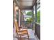 Relaxing front porch with comfortable seating and charming brick accents at 774 Creekside Dr, James Island, SC 29412