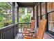 Cozy front porch with rocking chairs, perfect for enjoying the outdoors at 774 Creekside Dr, James Island, SC 29412
