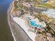 Stunning aerial view showcasing oceanfront property with pools, beach access, and beautiful landscaping at 930 Sealoft Villa Dr, Seabrook Island, SC 29455