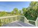 Spacious wood deck with lush trees and beautiful views of the surrounding scenery at 930 Sealoft Villa Dr, Seabrook Island, SC 29455