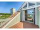Balcony with wood flooring and a beautiful view of the community at 930 Sealoft Villa Dr, Seabrook Island, SC 29455