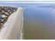 Expansive aerial view of a pristine beachfront property with gentle waves and clear blue water at 930 Sealoft Villa Dr, Seabrook Island, SC 29455