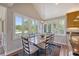 Dining area with views of water and greenery with a large table and seating for six at 930 Sealoft Villa Dr, Seabrook Island, SC 29455