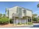 Exterior shot of the property showcasing elevated construction and well-maintained landscaping at 930 Sealoft Villa Dr, Seabrook Island, SC 29455