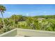 Scenic view from a balcony overlooking a lush golf course, surrounded by beautiful landscaping with mature trees at 930 Sealoft Villa Dr, Seabrook Island, SC 29455
