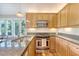 Well-lit kitchen featuring stainless steel appliances, granite countertops, and light wood cabinetry at 930 Sealoft Villa Dr, Seabrook Island, SC 29455