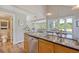 Kitchen island featuring stainless steel sink and dishwasher and granite countertops at 930 Sealoft Villa Dr, Seabrook Island, SC 29455