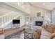 Living room with high ceilings, fireplace, and staircase at 930 Sealoft Villa Dr, Seabrook Island, SC 29455