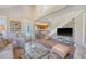 Open-concept living room with staircase and kitchen view at 930 Sealoft Villa Dr, Seabrook Island, SC 29455