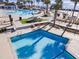 Relaxing pool area with palm trees, multiple pools, lounge chairs, and inviting beach access at 930 Sealoft Villa Dr, Seabrook Island, SC 29455