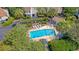 Aerial view of a refreshing community pool surrounded by lush greenery and lounge chairs at 930 Sealoft Villa Dr, Seabrook Island, SC 29455