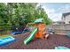 Spacious backyard with a playset, slide, swing, and trampoline offering outdoor fun at 9836 Black Tupelo Ln, Ladson, SC 29456